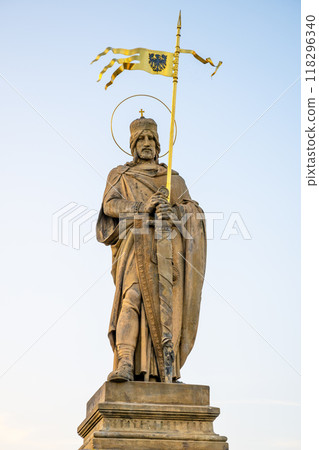 The statue of Saint Wenceslaus stands majestically in Stara Boleslav, Czechia, holding a golden flag. It is a symbol of Czech heritage and admiration for this important historical figure. 118296340