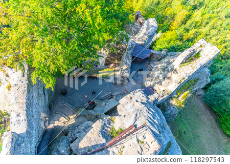 Frydstejn Castle ruins stand majestically, surrounded by lush greenery. Visitors explore the historic site while enjoying stunning views of the Bohemian Paradise in Czechia. 118297543