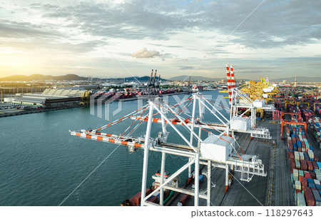 Logistics and transportation of container cargo ship at ship port. Container truck and crane bridge in shipyard. Import export and transport industry. Terminal port for export transport by ship. Logistics and transportation of container cargo ship at ship port. Container truck and crane bridge in shipyard. Import export and transport industry. Terminal port for export transport by ship. 118297643