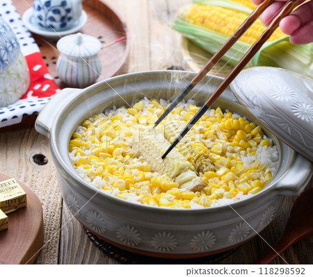 Corn rice cooked in a clay pot Corn rice cooked in a clay pot 118298592