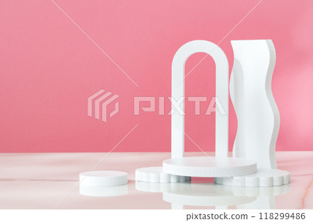 Decorative podiums against pink background in studio 118299486