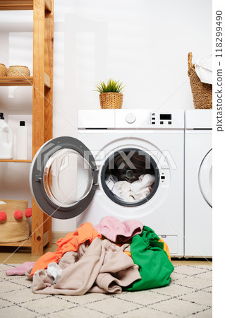 Laundry Day in a Modern Home With White Washers and a Wooden Shelf Laundry Day in a Modern Home With White Washers and a Wooden Shelf 118299490