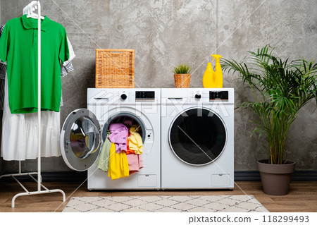 Open Front Loading Washing Machine With Colorful Clothes 118299493