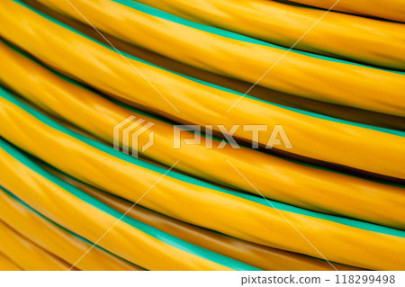 Close-Up of Yellow and Green Striped Electrical Cable Close-Up of Yellow and Green Striped Electrical Cable 118299498