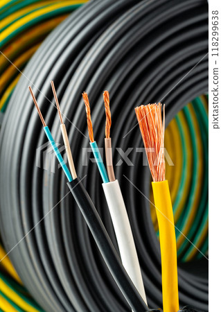 Closeup of Stripped Electrical Wires Against Rolled Cable Closeup of Stripped Electrical Wires Against Rolled Cable 118299638