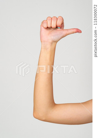 Womans Hand With Blue Nail Polish on gray background. 118300072