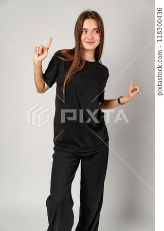 Young Woman Holding Hands Up in Air 118300436