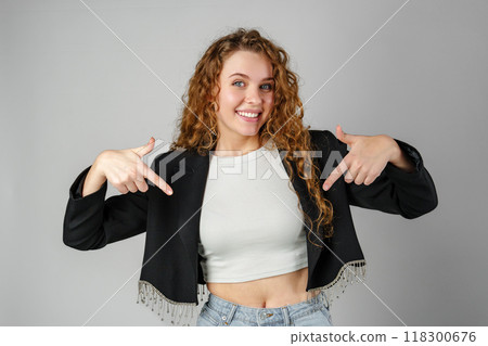 Woman in Crop Top and Jeans Pointing Down Woman in Crop Top and Jeans Pointing Down 118300676