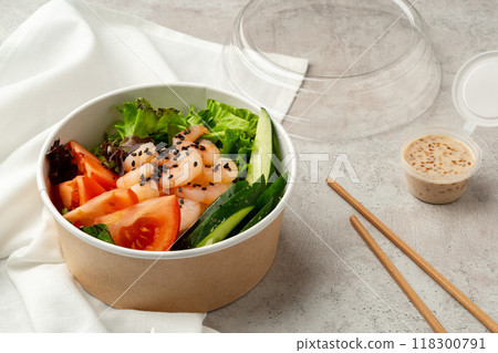 Tasty poke bowls on gray textured surface 118300791