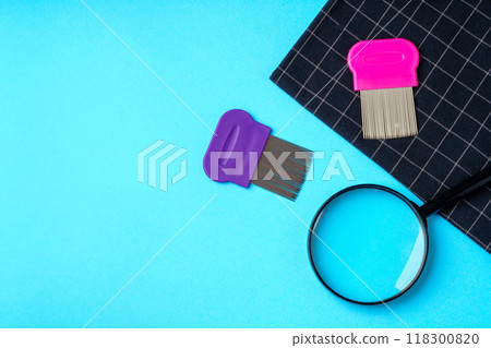 Anti lice equipment on blue background top view Anti lice equipment on blue background top view 118300820