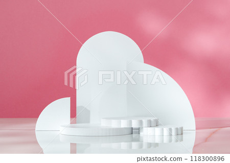 Decorative podiums against pink background in studio 118300896