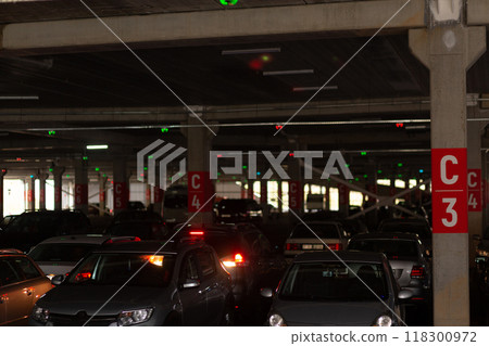 Neon multi-level underground parking in a shopping center. Neon multi-level underground parking in a shopping center. 118300972