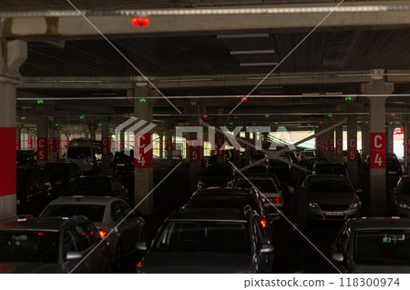 Neon multi-level underground parking in a shopping center. Neon multi-level underground parking in a shopping center. 118300974