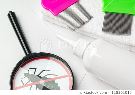 Medicine, lice comb and magnifying glass isolated on white Medicine, lice comb and magnifying glass isolated on white 118301013