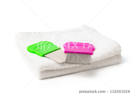 Anti lice combs and towel on white background Anti lice combs and towel on white background 118301029