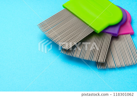 Comb for lice removing on blue background 118301062