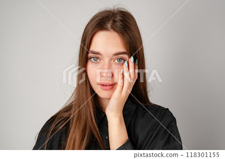 Young Woman in Black Shirt and Black Pants in Studio 118301155