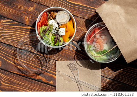 Take out poke bowl on wooden background 118301158
