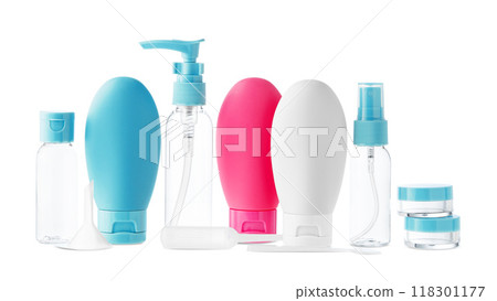 Clear plastic bottles with blue pumps and spray tops arranged on a white background Clear plastic bottles with blue pumps and spray tops arranged on a white background 118301177