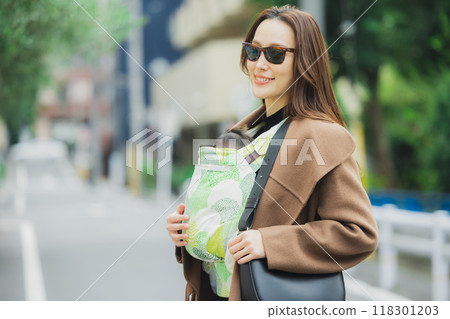 Mother walking with baby 118301203