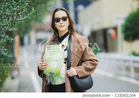 Mother walking with baby Mother walking with baby 118301204