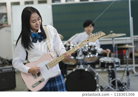 High school girl playing electric guitar Photography cooperation: Ariake College of Education and Arts High school girl playing electric guitar Photography cooperation: Ariake College of Education and Arts 118301306