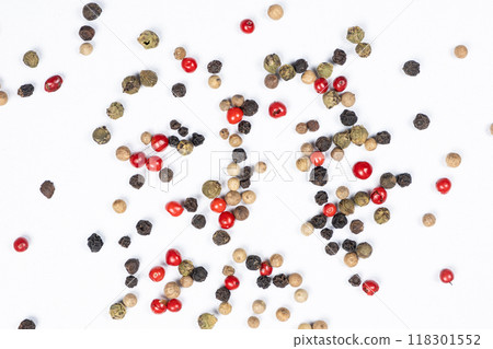 Red, green, white and black peppercorns on a white background top view. 118301552