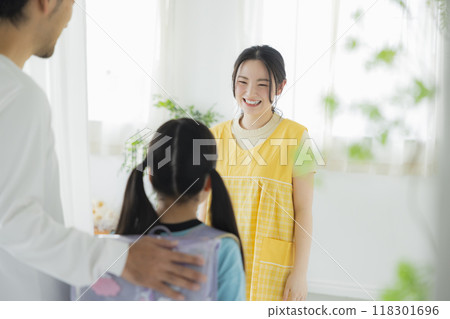After-school care teacher and elementary school students 118301696