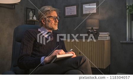 Mature therapist in glasses talks to depressed patient, provides behavior therapy 118304057