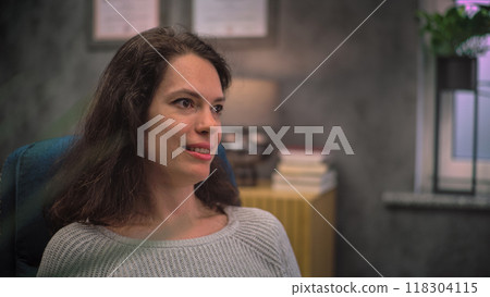 Portrait of adult woman discussing problems with psychologist 118304115