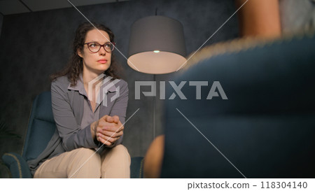 Female psychotherapist communicates and provides psychotherapy Female psychotherapist communicates and provides psychotherapy 118304140