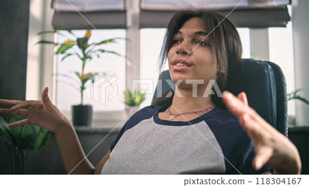 African American girl teenager shares positive emotions on counseling therapy session 118304167