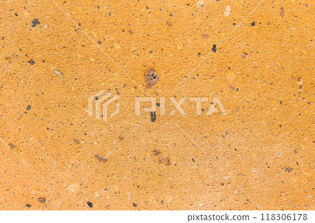 polished yellow tuff stone on wall in Armenia 118306178