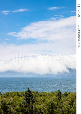 arge white cloud over shore of Lake Sevan, Armenia 118306215