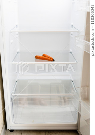 front view of refrigerator with withered carrots front view of refrigerator with withered carrots 118306342