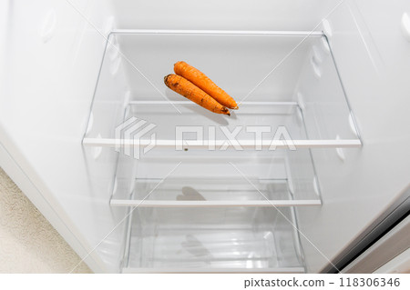 above view of refrigerator with withered carrots above view of refrigerator with withered carrots 118306346