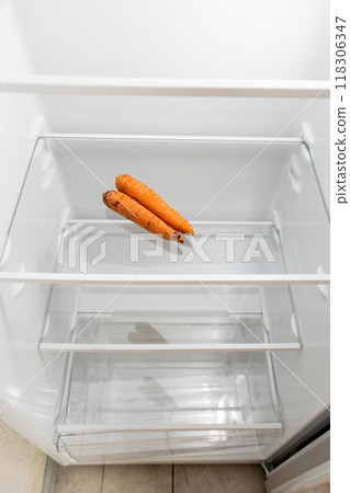 above view of home refrigerator with dried carrots above view of home refrigerator with dried carrots 118306347