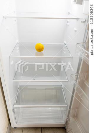 refrigerator with single fresh lemon on shelf refrigerator with single fresh lemon on shelf 118306348