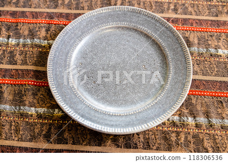 above view of ceramic plate on brown tablecloth above view of ceramic plate on brown tablecloth 118306536