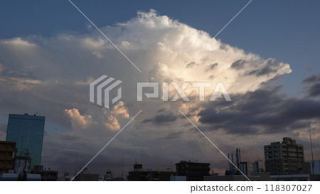 Buildings and white clouds in the blue sky 118307027