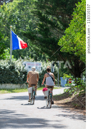 Person riding a bicycle on a cycle path Person riding a bicycle on a cycle path 118310337