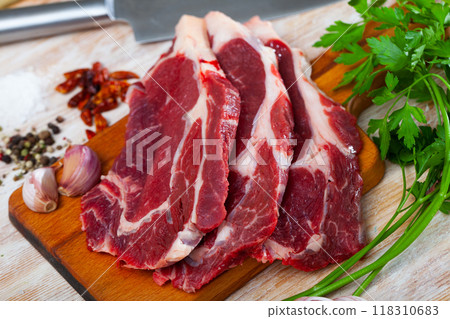 Raw boneless beef with seasonings prepared for roasting Raw boneless beef with seasonings prepared for roasting 118310683