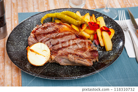 Beef sirloin steak with fries, pepper, onion, tomatoes 118310732