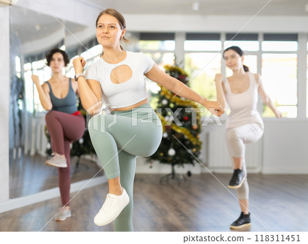 Group of women dancing dancehall in studio Group of women dancing dancehall in studio 118311451