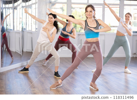 Funk jazz dancers practicing dance moves in studio 118311496