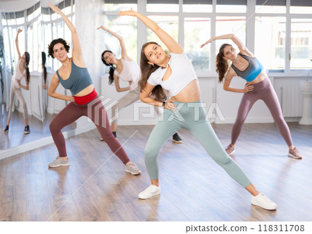 Group of women dancing dancehall in studio Group of women dancing dancehall in studio 118311708