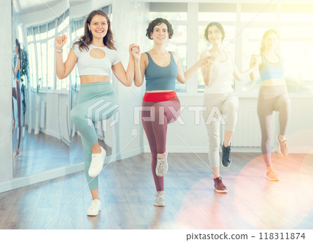 Group of girls with middle-aged woman perform Irish folk dance Group of girls with middle-aged woman perform Irish folk dance 118311874