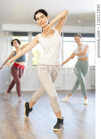 Group of women dancing modern dance in studio 118311930