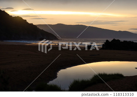 Sunset Breaking Through Clouds at Laga Beach, Basque Country Sunset Breaking Through Clouds at Laga Beach, Basque Country 118313310