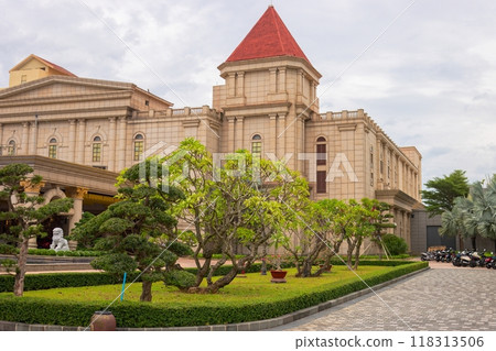 Castle with a red roof with trees next to it 118313506